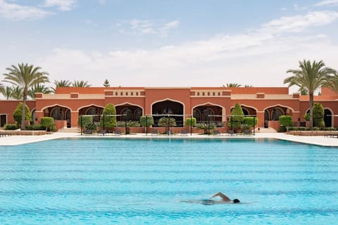 Swim slow laps in sparkling water under open skies.