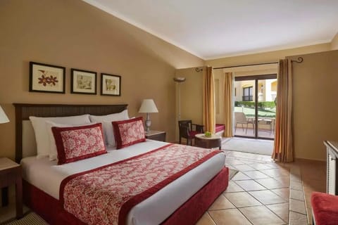 Savor slow mornings in a cozy king room with terrace doors.