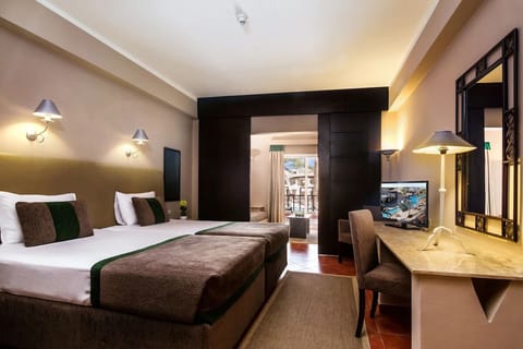 Recharge in a bright room designed for easy, shared stays.