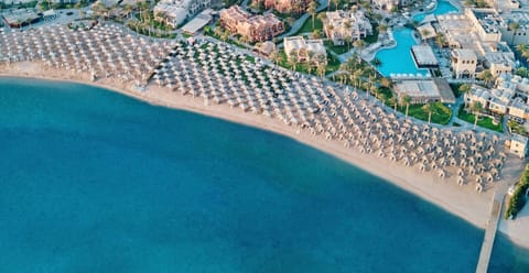 Imagine mornings on a private-feeling beach beside turquoise water