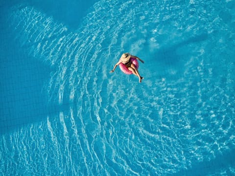 Float weightlessly in sparkling water for a carefree afternoon escape.