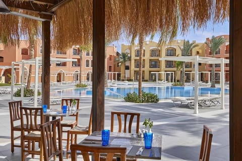 Claim your sunbed early and savor the serene courtyard.