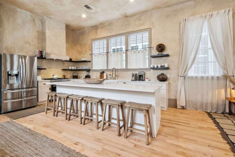 Fully Equipped Kitchen with Brand New Stainless Steel Appliances, Bar Seating and Natural Light