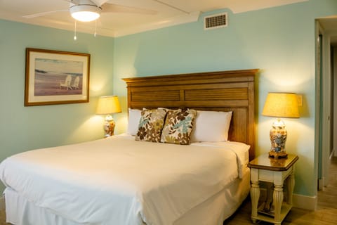 Drift off beneath soft ламplight in this calming bedroom.