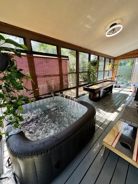 Enjoy a relaxing hot tub and fun games in your private enclosed patio!
