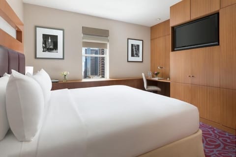 Settle in with a roomy layout, TV, and work nook.