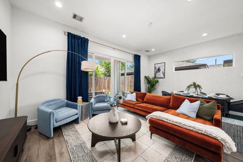 Lush living room with large couch. and plush wing chairs