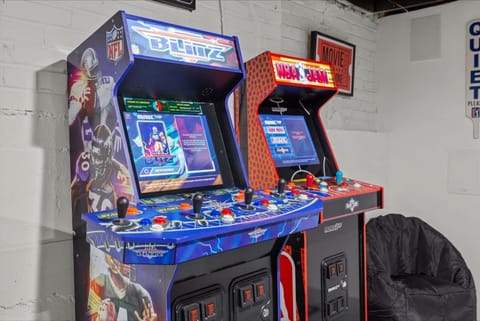 Hours of entertainment await in the game room with multiple arcade machines.