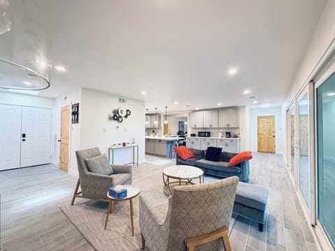 Family room open to the kitchen and beautiful water view of the back yard