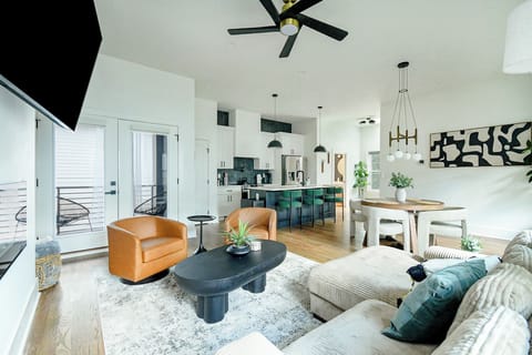 Spacious open-concept living area with designer furnishings and modern finishes — the perfect place to relax or entertain.