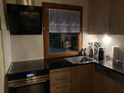 Kitchen Appliance, Kitchen, Wood, Cabinetry, Major Appliance, Interior Design, Countertop, Flooring, Home Appliance, Lighting