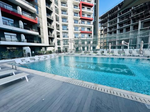 Resort-Style Pool: Dive into relaxation at our stunning pool, complete with lounge chairs!