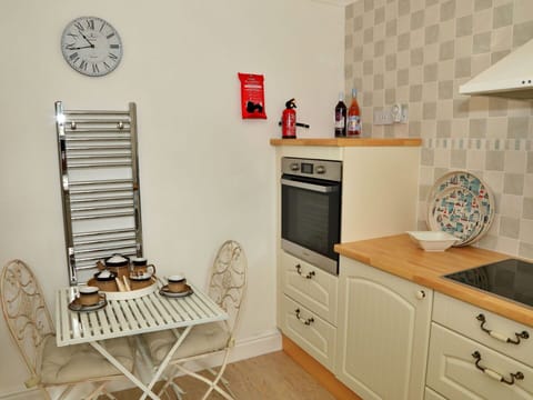 Flooring, Interior Design, Furniture, Wood, Floor, Kitchen, Cabinetry, Room, Countertop, Lighting