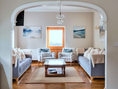 Furniture, Interior Design, Wall, Couch, Flooring, Wood, Floor, Living Room, Lighting, Home