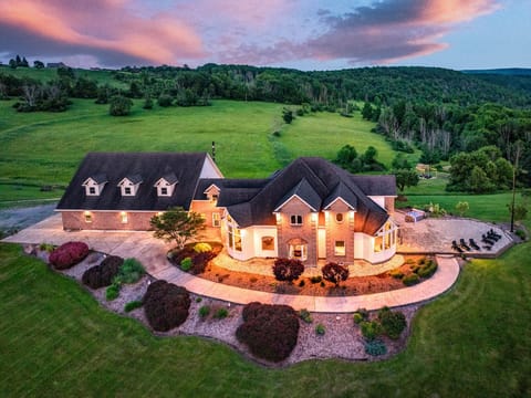 Front view of the property- Sitting in the center of 60 acres of fields and woods, this mountain mansion is secluded and boasts all you'll need.