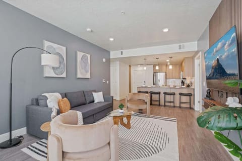 Natural light and cozy vibes – our living room features a TV and beautiful, large windows.
