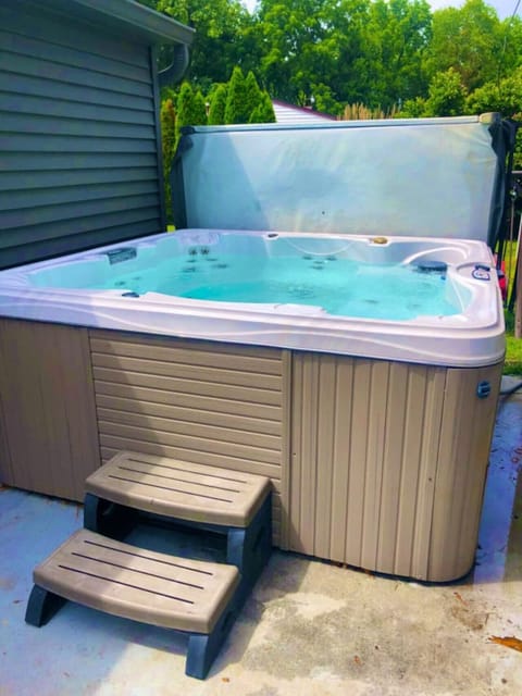 Relax and recharge in the bubbling comfort of your own outdoor hot tub oasis.