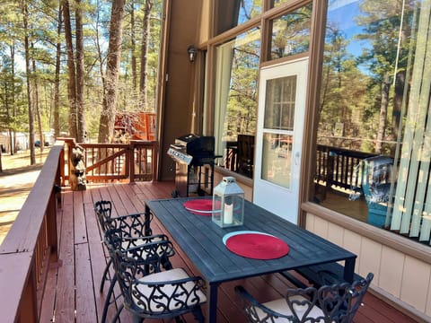 The spacious deck has a table, seating for 8, a gas grill and wonderful views.