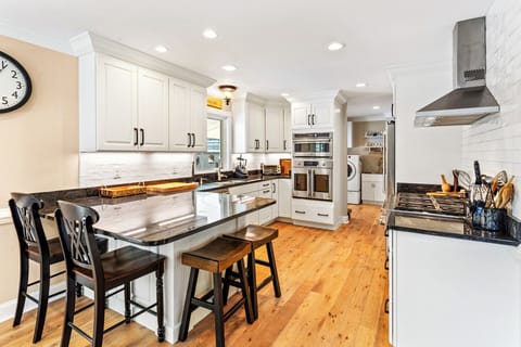 Whip up gourmet meals in the sleek Kitchen with stainless-steel appliances and a 6-burner gas stove.