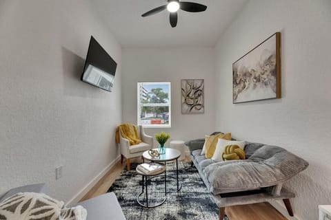 Adorable Seating Area with TV for unwinding after a day at the Beach