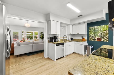 Open-concept living at its finest—our living room and kitchen are designed for togetherness.