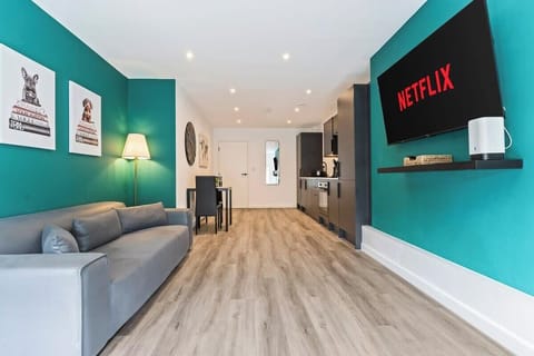 Living Room/Kitchen with Smart TV, Sofa and Fully Equipped Kitchen