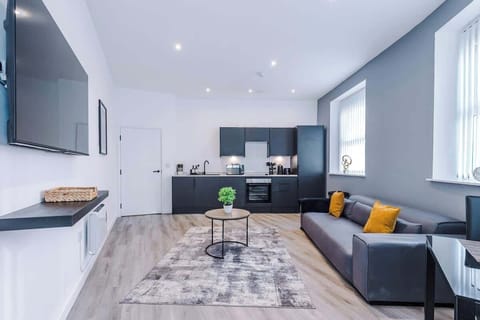 Open Plan Kitchen/Living Area with Sofa and Smart TV
