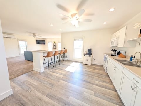 Kitchen space with everything you need to make homemade meals in the apartment or enjoy takeout at the eat-in countertop in the upstairs unit.