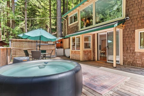 Enjoy the Softub hot tub on the deck just outside the primary bedroom.