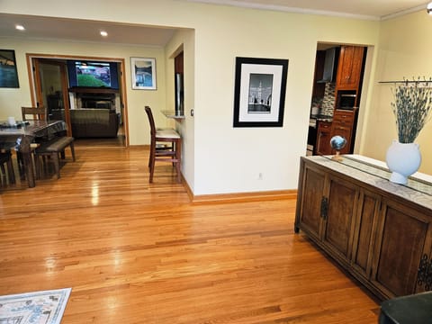 The living room has an open layout into the dining room.