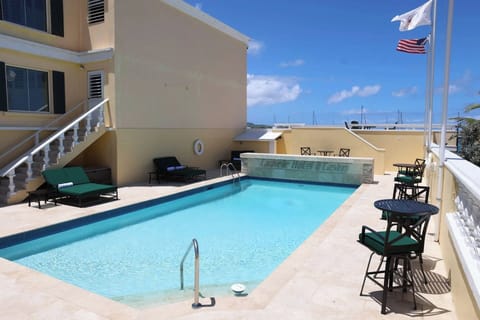 Cool off with an easy swim in the sunlit pool.