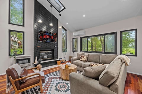 Bright and airy space with a stunning view, perfect for movie nights by the fire!