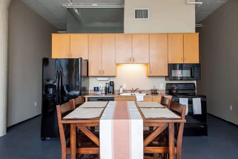 Kitchen 2 is fully stocked, including a Keurig with assorted coffee cups.