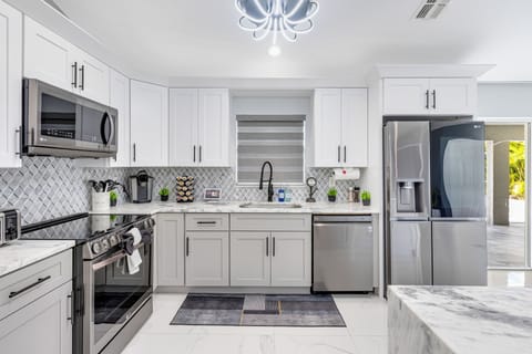 Spacious, fully stocked kitchen with smart appliances and an island