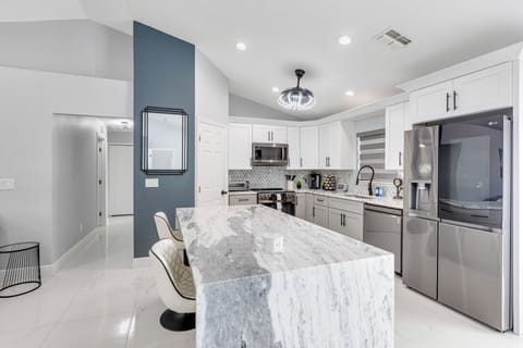 Bright open kitchen with island seating for four