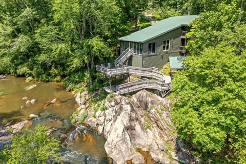 Perched above the creek with stunning views, this multi-level deck invites you to relax, sip coffee at sunrise, or enjoy wine at sunset, just steps from the comfort of your private retreat.