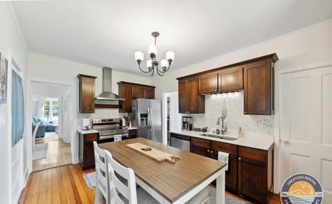Cook and gather in the fully equipped kitchen with generous counter space and an inviting island. Ideal for prepping meals while staying connected with family and friends.