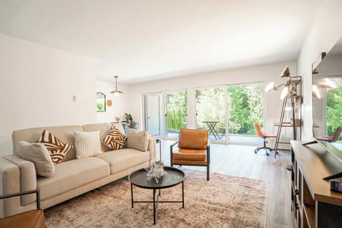Cozy living room with easy access to the backyard for relaxing and fresh air.