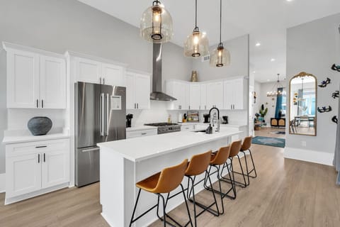 Fully-stocked kitchen with high-end Bosch appliances, including a large side-by-side fridge, gas stove & oven, microwave, and dishwasher. Also featuring a toaster, electric kettle, Keurig & drip coffee makers, and cofee & tea!