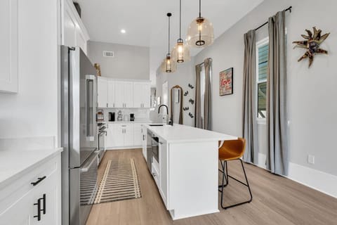 Fully-stocked kitchen with high-end Bosch appliances, including a large side-by-side fridge, gas stove & oven, microwave, and dishwasher. Also featuring a toaster, electric kettle, Keurig & drip coffee makers, and cofee & tea!