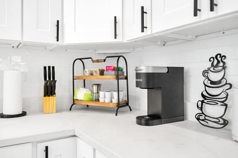 Fully-stocked kitchen with high-end Bosch appliances, including a large side-by-side fridge, gas stove & oven, microwave, and dishwasher. Also featuring a toaster, electric kettle, Keurig & drip coffee makers, and cofee & tea!