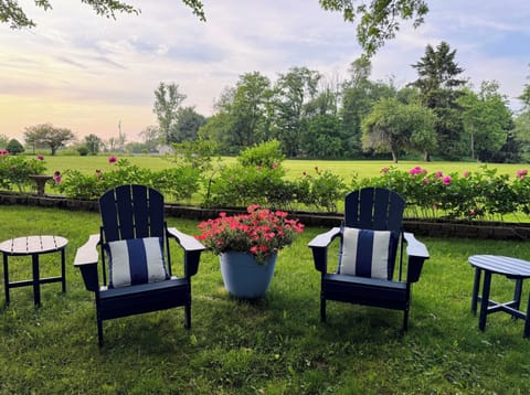 Huge yard with plenty of seating to enjoy the scenic views in a wooded setting.