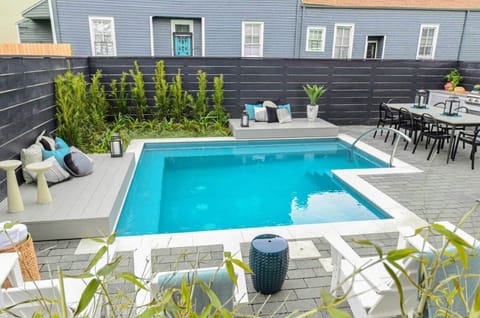 Shared Outdoor Area with Porch | Seasonal Heated Pool | Grill | Outdoor Dining Table | Outdoor Seating Area | Shared with Other Units in Building