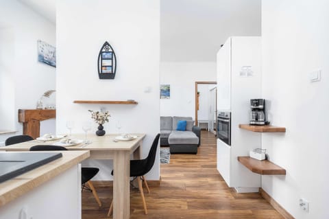 Fully equipped kitchen with dining table.