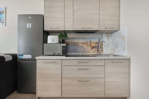 A dining and kitchen combo viewed from a different angle, showcasing the open layout and bright atmosphere.