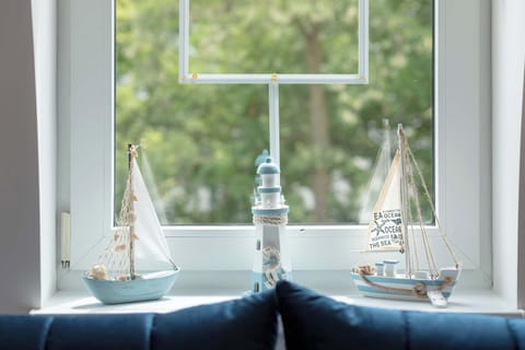 The living room's beautiful design complemented by natural light streaming in.