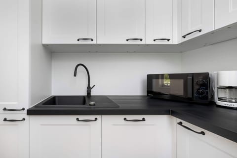 The kitchenette's practical layout maximizes space and functionality.