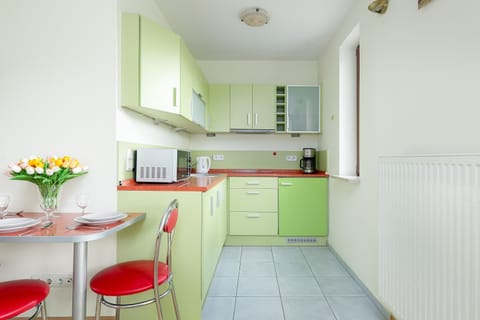 Kitchenette with full equipment and dining area.