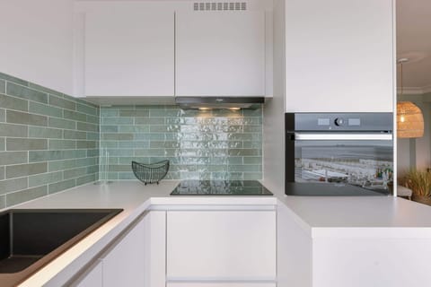 Stylish Kitchen with Green Tile Backsplash
