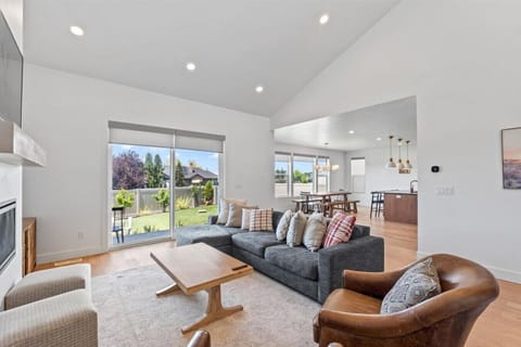 Living room with open layout, comfortable seating, and natural light